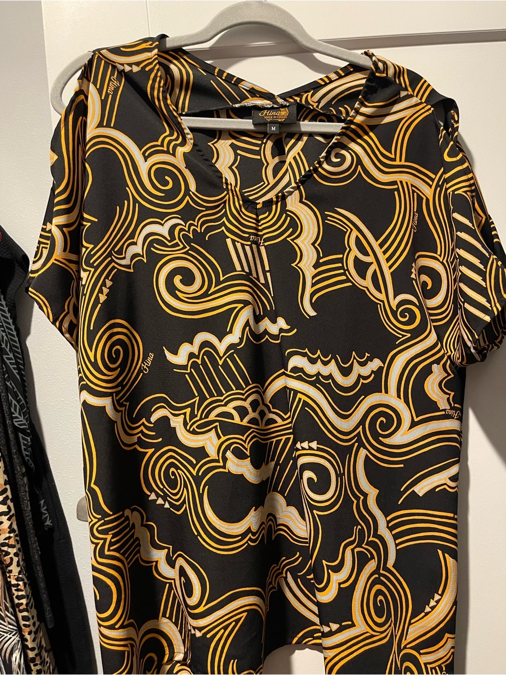 Hina Hawai’i Black, Gold & Cream Swirl-Print V-Neck Blouse cut top sleeve